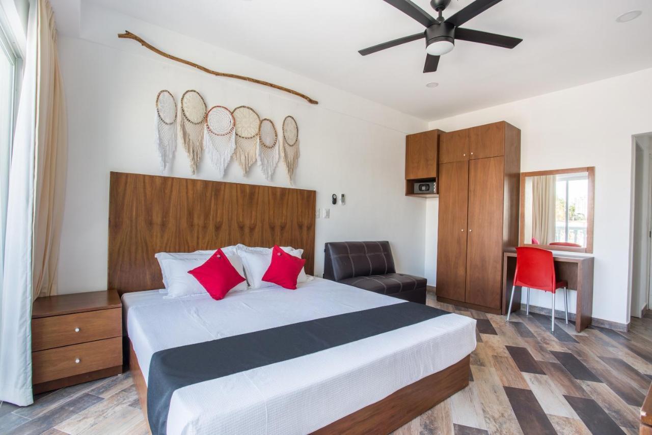 Capital O Cancun Ocean View, Cancún Extérieur photo A bedroom at the hotel