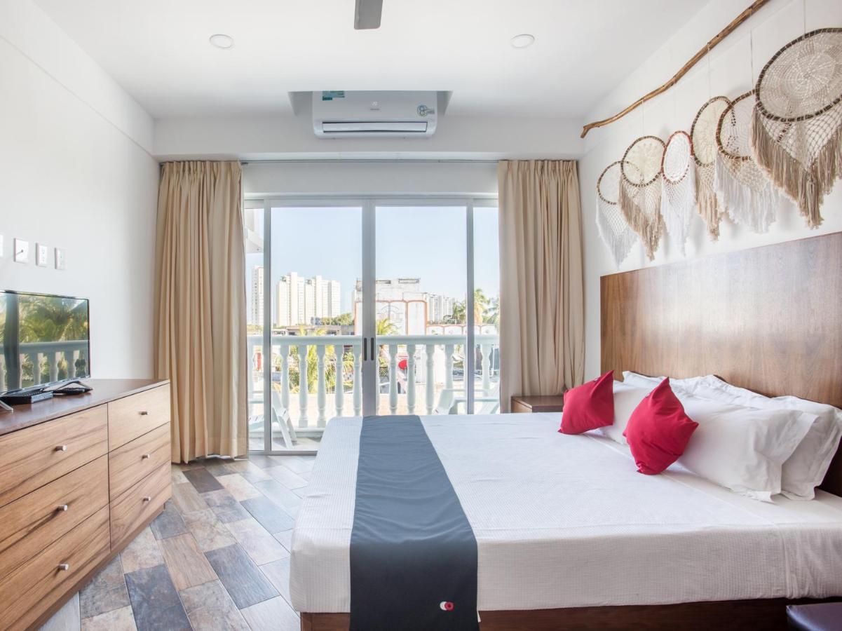 Capital O Cancun Ocean View, Cancún Extérieur photo A bedroom at the hotel