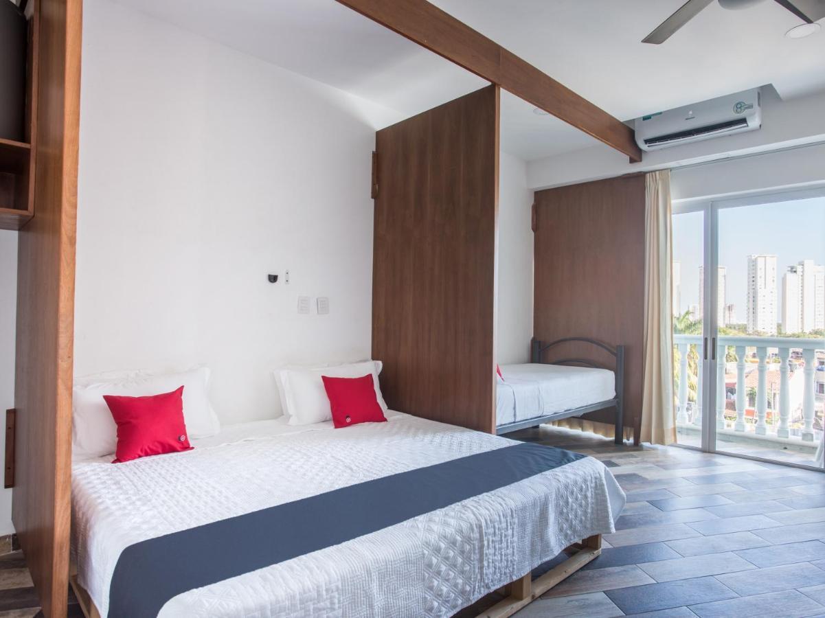 Capital O Cancun Ocean View, Cancún Extérieur photo A bedroom at the hotel